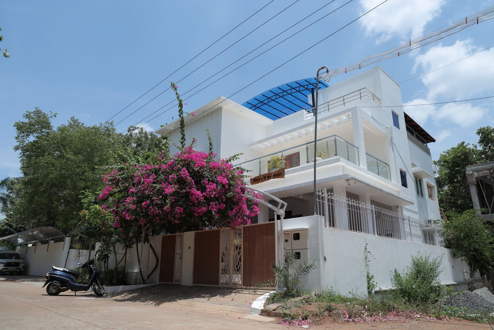 Thilaga White House behind the bougainvillea